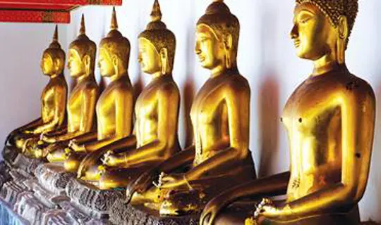 Large golden Buddha statues at Wat Mahatat