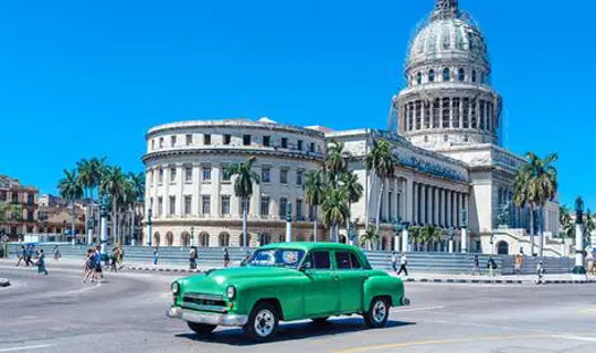 Classic Green American car in Cuban street