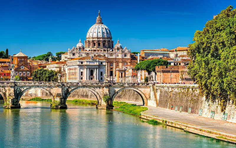 View of the Tiber river and city in Rome - best cities in Italy
